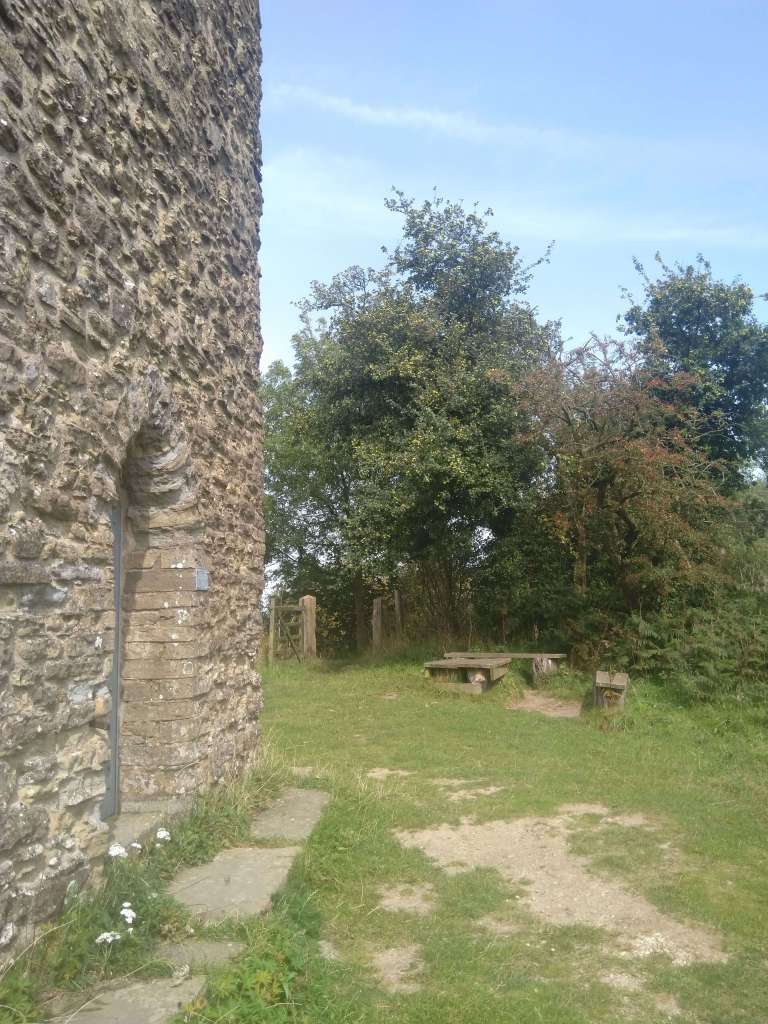 Picnic bench and entrance to Flounders Folly